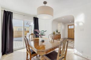 a dining room with a wooden table and chairs at Library House in Durango