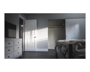a bedroom with a bed and a dresser at Pleasant View House in Freeland