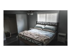 a bedroom with a bed in a room with a window at Pleasant View House in Freeland