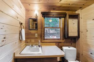 a bathroom with a sink and a toilet at The Pinecone in Winthrop