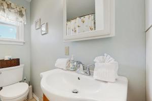 a white bathroom with a sink and a toilet at Lil in York +31 photos