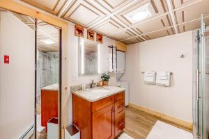 a bathroom with a sink and a shower at Camp Two Loons in Oxford +61 photos