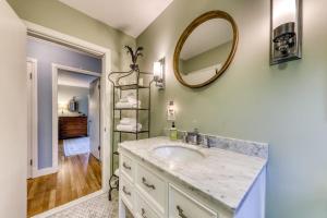 a bathroom with a sink and a mirror at Kennebunk Family Cottage in Kennebunk +58 photos