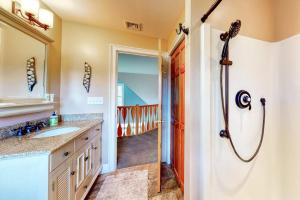 a bathroom with a shower and a sink at Stone Creek Retreat in Cape Neddick +55 photos