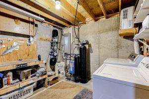 a garage with a washing machine in a room at Sunday River Sunny Chalet in Bethel +43 photos