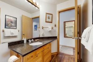 a bathroom with a sink and a mirror at East Bay 6 in Dillon +67 photos