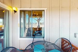 a table and chairs sitting outside of a window at Pines 4058 in Pagosa Springs