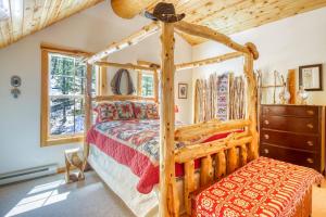 a bedroom with a wooden bed and a dresser at Heaven's Gate in Durango