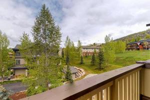 a view from a balcony of a house with a yard at Steamboat Springs 1308 in Steamboat Springs