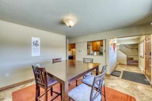 a dining room with a wooden table and chairs at 615 Oro Grande in Dillon