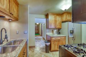 a kitchen with a sink and a refrigerator at 615 Oro Grande in Dillon +38 photos