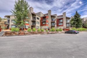 a parking lot in front of a large building at Beautiful Mountain View Condo in Crested Butte