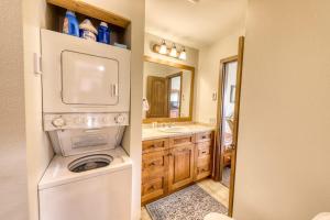 a small bathroom with a washer and dryer in it at Beautiful Mountain View Condo in Crested Butte +46 photos