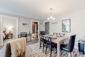 a dining room and living room with a table and chairs at Mountain Getaway in Crested Butte
