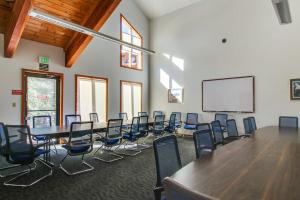a conference room with a long table and chairs at Timber Ridge Condo in Silverthorne +46 photos