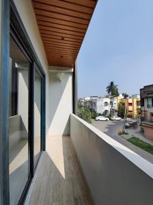 a balcony with a view of a street at Stay by Insata Hospitality - Kolkata in Kolkata