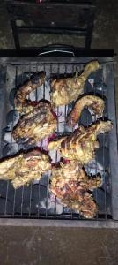 a bunch of food cooking on a grill at Eco Camping Resort Ella in Bandarawela
