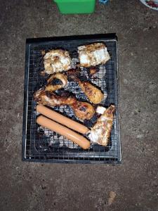a grill with a bunch of food on it at Eco Camping Resort Ella in Bandarawela