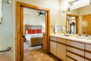 a bathroom with a bed and a sink and a mirror at Pagosa Peak View in Pagosa Springs +75 photos