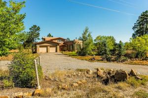 a house with a fence in front of it at Pagosa Peak View in Pagosa Springs