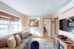 a living room with a couch and a tv at Jarvis #202 in Durango