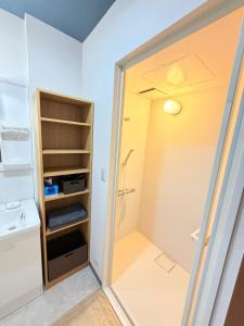 a walk in shower in a small bathroom at 雅 in Kyoto +42 photos