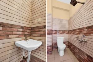 a bathroom with a sink and a toilet at Hotel O Benz Circle Crossway Vijayawada Formerly Akshaya Elite in Vijayawada
