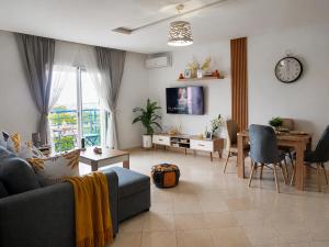 a living room with a couch and a table at Buenavista CaboNegro in Cabo Negro