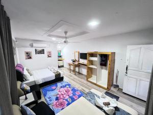 a living room with a couch and a table at Asni chalet in Marang