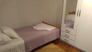 Postel nebo postele na pokoji v ubytování Penthouse Znjan