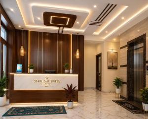 a lobby of a hotel with a reception desk at Star Light Suites in Bangalore