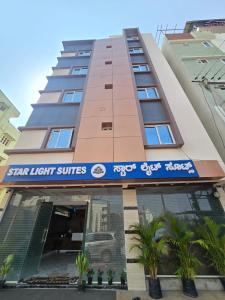 a tall building with a star light suites sign on it at Star Light Suites in Bangalore