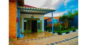 an entrance to a house with an open door at Breeze House Hotel in Kigali