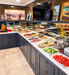 a buffet with many different types of food at Kadirga Antik Hotel - Sultanahmet in Istanbul
