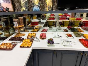 a buffet line with many different types of desserts at Kadirga Antik Hotel - Sultanahmet in Istanbul