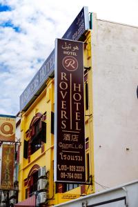 a sign for a hotel on the side of a building at Rovers Hotel Kubang Kerian in Kota Bharu
