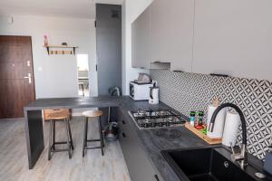 a kitchen with a stove and a counter top at Apartament 16 in Sandomierz +10 photos