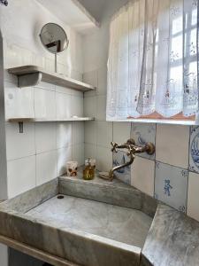 a kitchen with a sink and a faucet at Agriturismo Coppi Rossi in Imperia +77 photos
