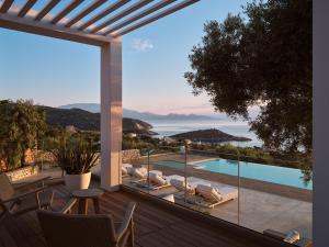a view from the balcony of a villa with a pool at PanoPlagia Villa in Agios Nikolaos