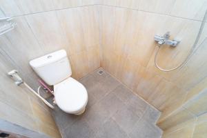 a bathroom with a toilet and a shower at Tempuran Suites By ARBA in Kejayan +18 photos
