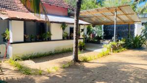 a house with plants on the side of it at JA Villa in Pottuvil
