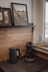 a coffee maker on a counter in a kitchen at Apartment Claussen 1 in Bremerhaven