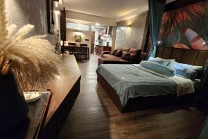 a bedroom with a bed and a living room at Resort-Style 1BR-Epic Pool View-Walk to Beach in Bophut +2 photos