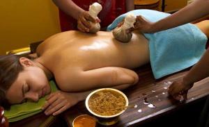 a naked woman getting a massage on a table at Bhatye Beach Resort MTDC in Ratnagiri