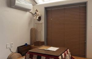 a room with a table and a stuffed animal on the wall at Damyang Hwayang in Damyang