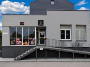 a fast food restaurant with its doors open at FB Apartaments in Plungė