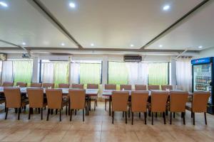 a conference room with a long table and chairs at Vasco Residency in Vasco Da Gama