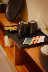 a black tray with two cups on a table at Mi Casa Coastal Villa in Akurala +23 photos