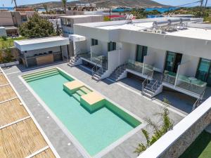 an aerial view of a house with a swimming pool at Prasonisi Lighthouse Studios in Prasonisi