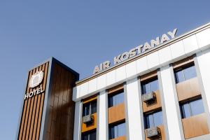 a building with a sign on top of it at Air Kostanay in Kostanay